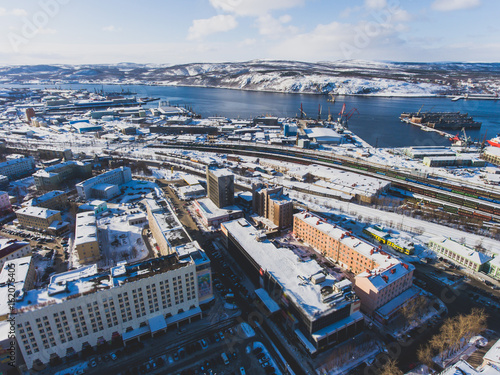 Beautiful aerial air winter vibrant view of Murmansk, Russia, a port city and the administrative center of Murmansk Oblast, Kola peninsula, Kola Bay, shot from quadcopter drone 