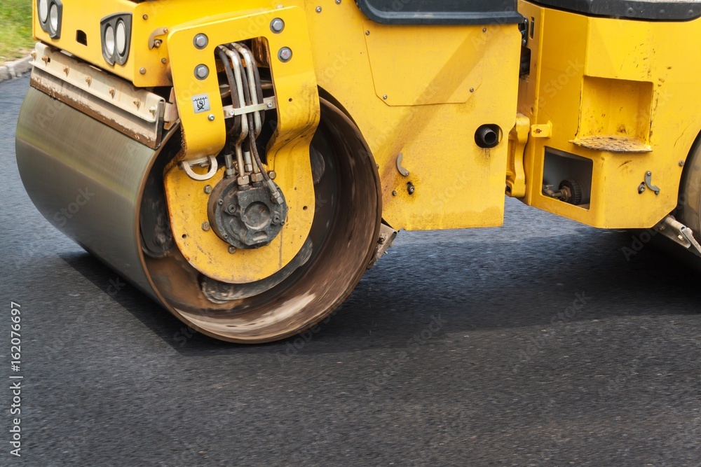 Fototapeta premium New asphalt road. Road asphalt works. Construction works.