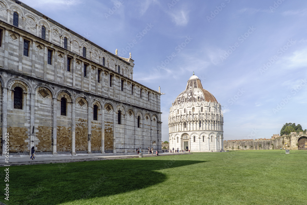 Baptistery of San Giovanni and side of the Duomo in Pisa in Italy