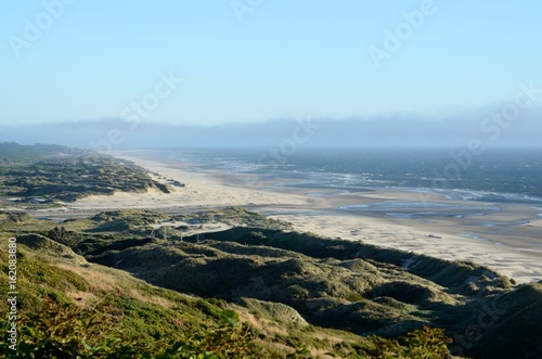 View of a long beach, dunes and coastline looking south towards Florence on the Oregon Central coast