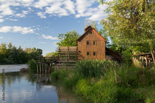 wooden house near the river © santiago silver