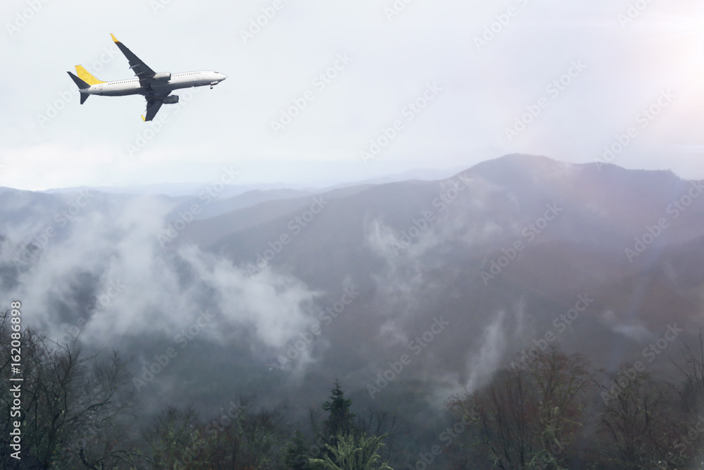 Morning flight on amazing view. airplane overlooking sunrise, mountain in the of forest mist and everything nice in yellow light view Morning flight on amazing view. airplane overlooking sunrise, mountain in the of forest mist and everything nice in yellow light view