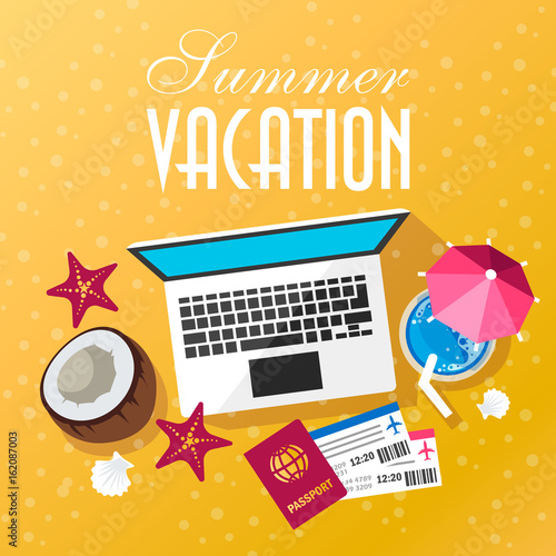 Summer trip. Air tickets, passport and laptop on the sand.