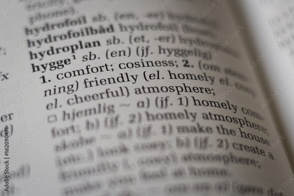 Close up of dictionary with the Danish word hygge translated to English Close up of dictionary with the Danish word hygge translated to English