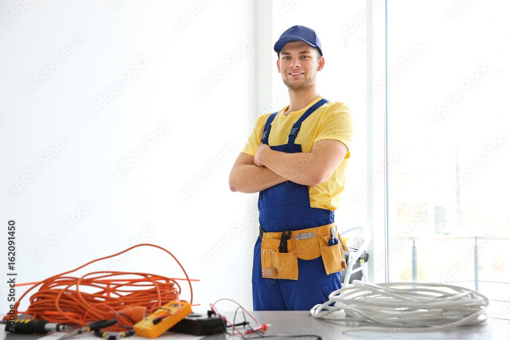 Young electrician at workplace Young electrician at workplace