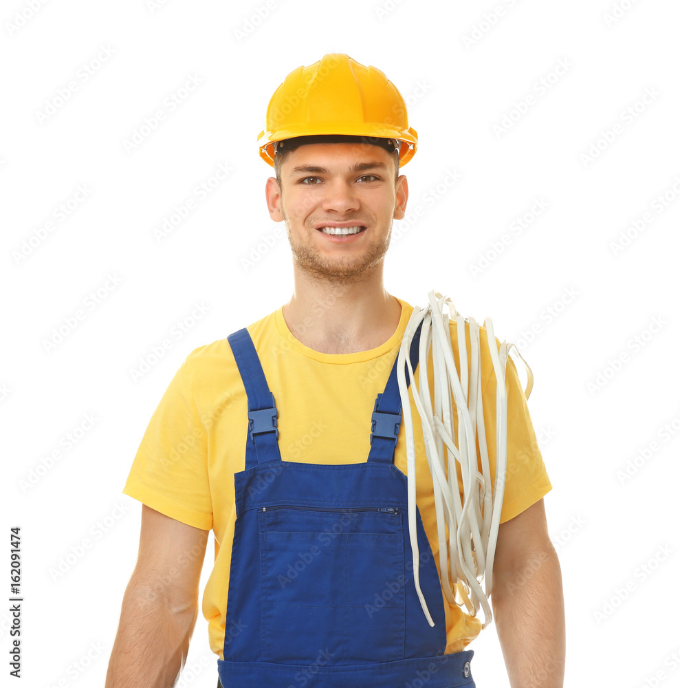 Young smiling electrician with bunch of wires on white background Young smiling electrician with bunch of wires on white background