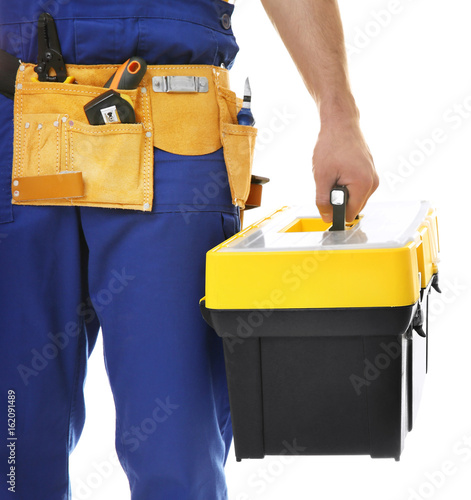 Electrician with toolbox on white background, closeup © Africa Studio