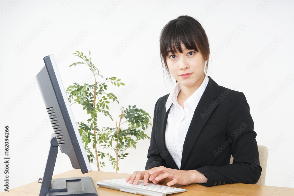 Businesswoman using a computer at office Businesswoman using a computer at office