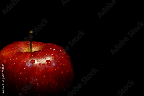 Red apple with black isolated background