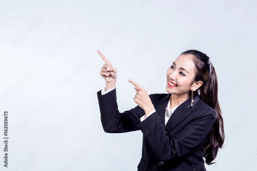 asian business woman in suit point to blank area with free copyspace for your creativity ideas text