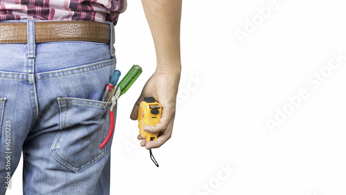 construction worker standing with  instrument in pocket and hand holding tape rule