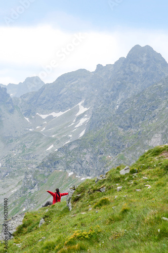 Person with arms outstretched to the nature