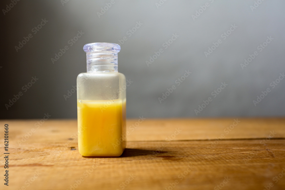 Safe product concept, Shampoo on wooden floor Safe product concept, Shampoo on wooden floor