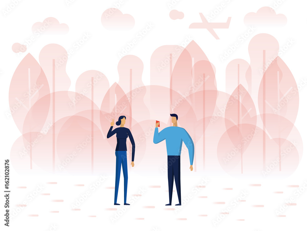 A man is taking his girlfriend photos by a smartphone. A man is taking his girlfriend photos by a smartphone.