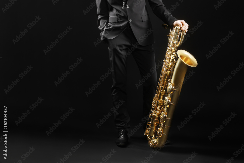 Naklejka premium Saxophone player jazz musician with baritone sax