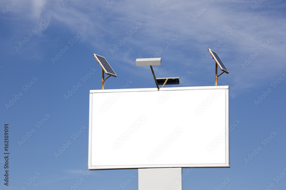 Blank billboard on a blue sky background. Solar panels Blank billboard on a blue sky background. Solar panels