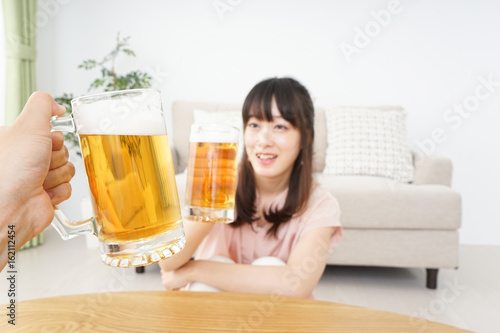 Young woman drinking beer