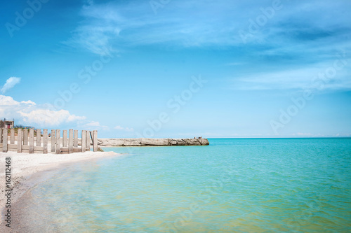 Beach of the sea coast with white sand and blue sky. © murika