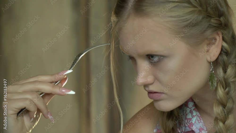 Blonde girl with a fork