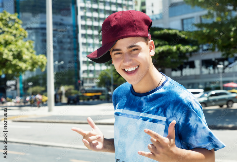 Posing rapper with baseball cap in the city