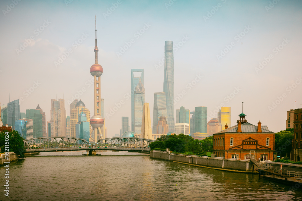 Shanghai city skyline with historical Waibaidu bridge, Shanghai, China