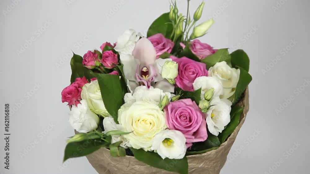 Bouquet of roses, eustoma and orchids on white background Bouquet of roses, eustoma and orchids on white background
