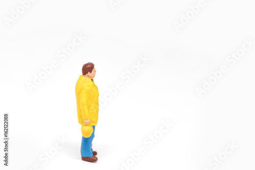 Miniature people worker safety construction concept on white background with a space for text