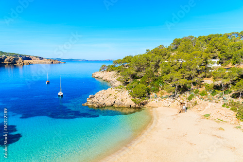 Fototapeta Naklejka Na Ścianę i Meble -  View of beautiful beach in Cala Salada famous for its azure crystal clear sea water, Ibiza island, Spain