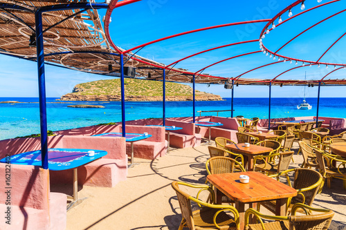 Coastal bar with beautiful sea view on Cala Comte beach, Ibiza island, Spain photo