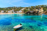 Dinghy boat in Cala Vadella bay, Ibiza island, Spain