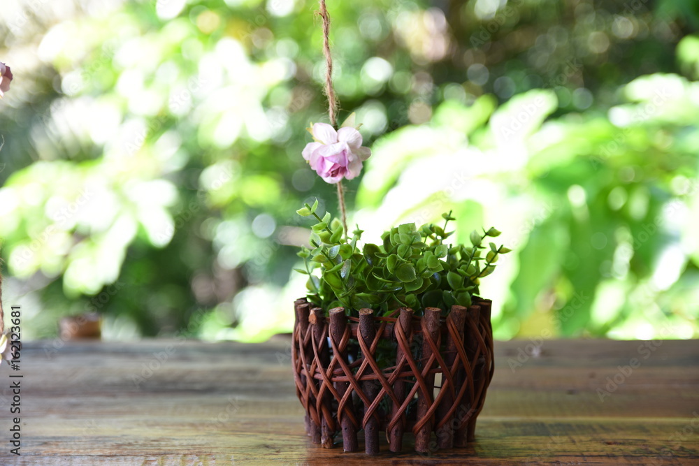 Vintage flowerpot with wild beautiful flowers on background soft focus and blurred.