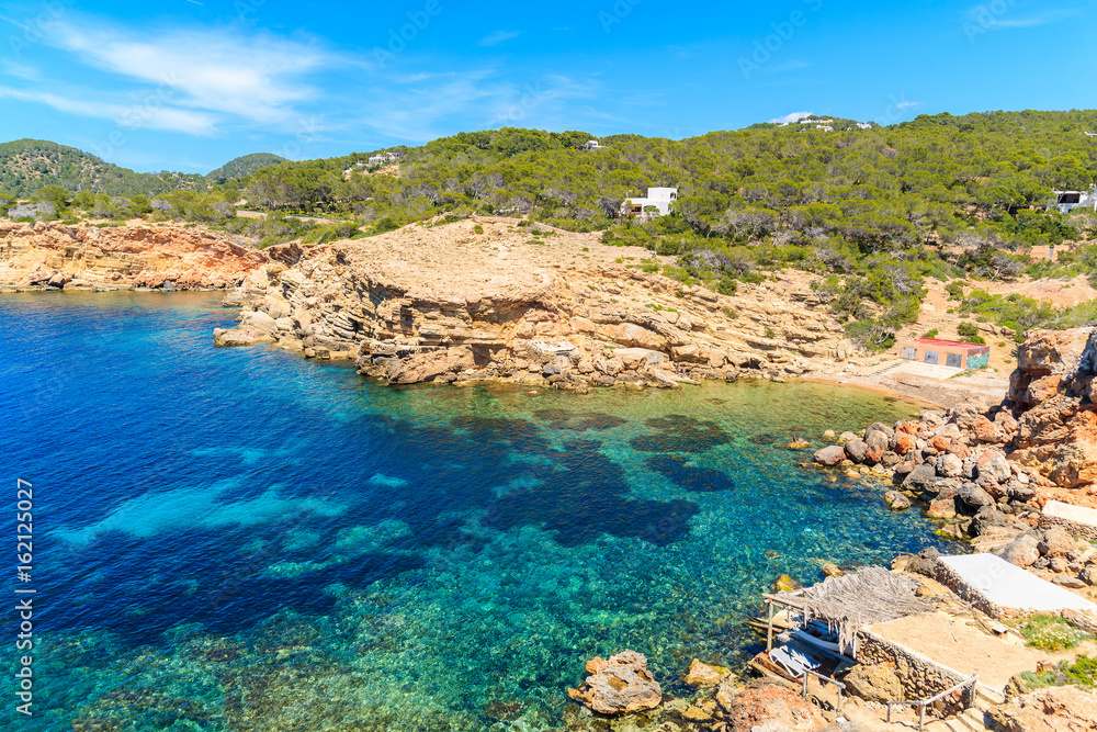 View of Punta Galera beach surrounded by amazing stone formations, Ibiza island, Spain