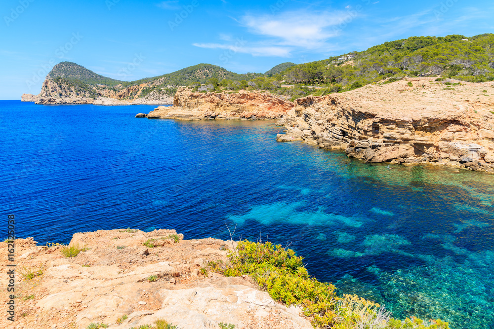 Obraz premium View of Punta Galera bay surrounded by amazing stone formations, Ibiza island, Spain