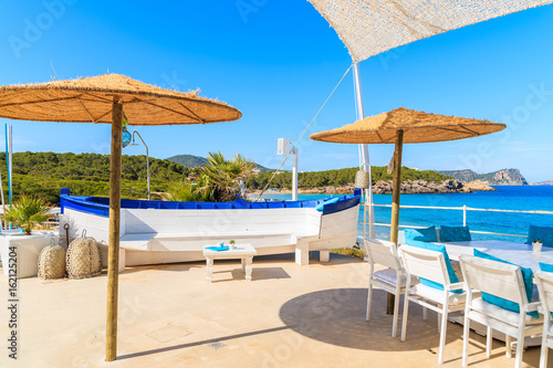 White skull of a fishing boat on sunny restaurant terrace on Cala Nova beach  Ibiza island  Spain.