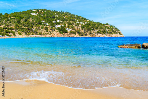 Fototapeta Naklejka Na Ścianę i Meble -  Sea wave on Cala San Vicente beach, Ibiza island, Spain