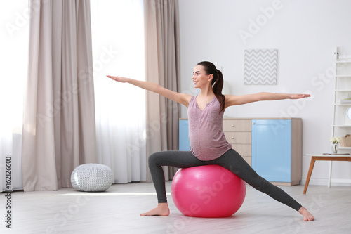 Beautiful pregnant woman do...