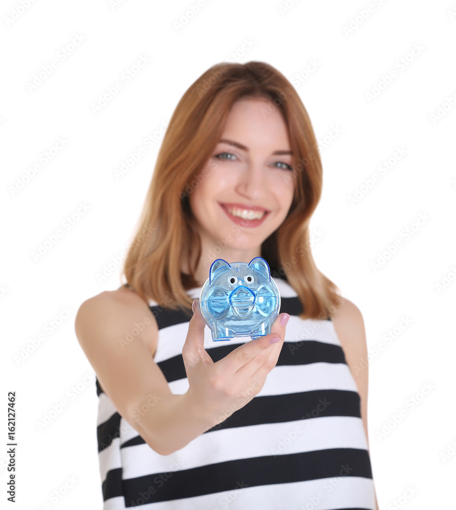 Happy young woman holding piggy bank on white background Happy young woman holding piggy bank on white background