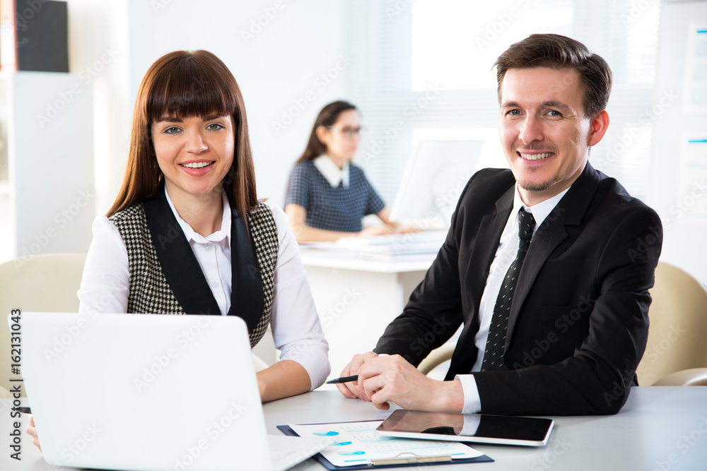 Business people are looking into the camera Business people are looking into the camera