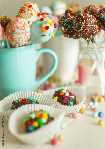 Image with photo filter of candies and pop cake