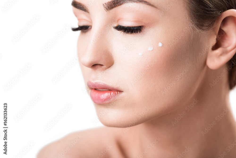 Serious attractive girl using cosmetics Serious attractive girl using cosmetics