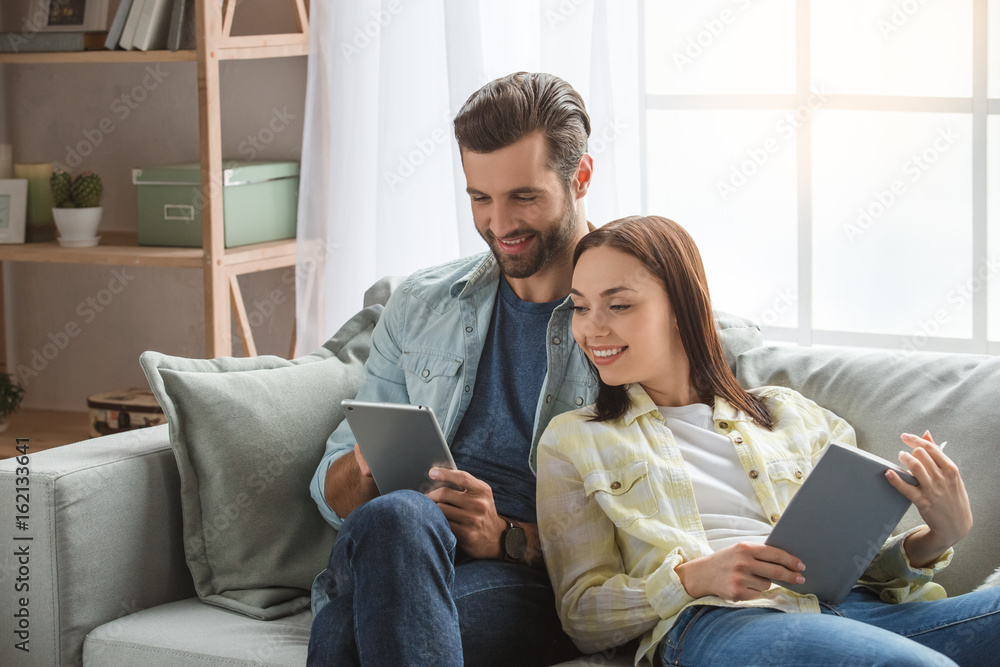 Young family couple together at home casual Young family couple together at home casual