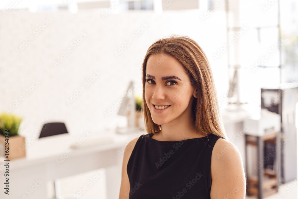 Attractive young woman customer with henna-colored eyebrows. Professional care for face. Attractive young woman customer with henna-colored eyebrows. Professional care for face.