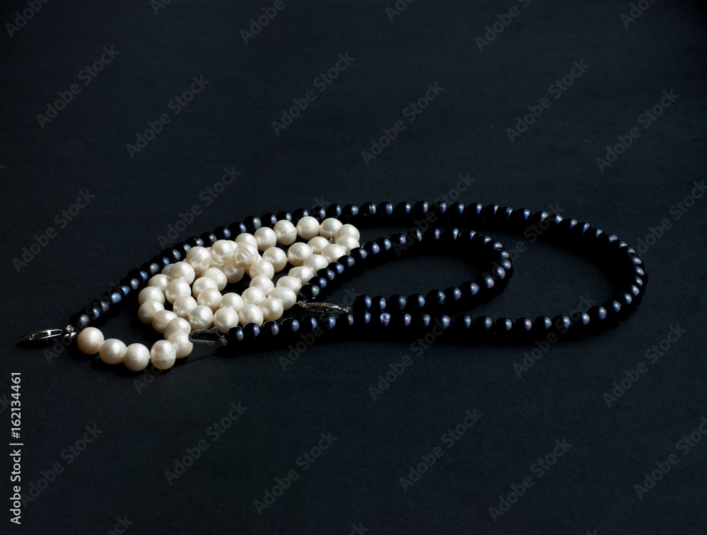 Black and white pearls black background