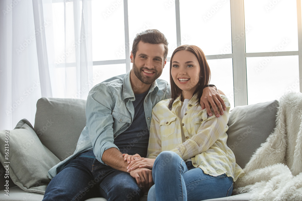 Young family couple together at home casual Young family couple together at home casual