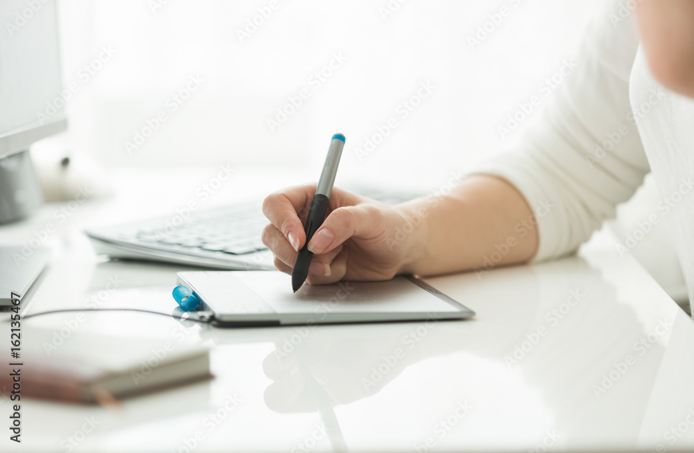 Young woman working with digital graphic tablet Young woman working with digital graphic tablet
