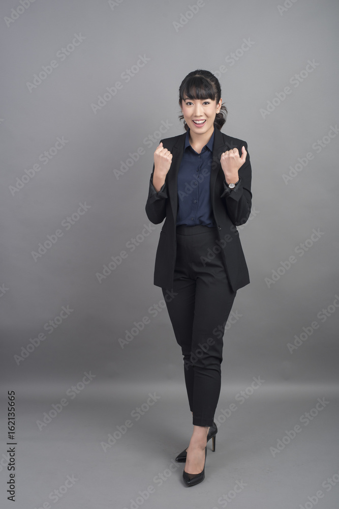 Beautiful Business Woman success on grey background Beautiful Business Woman success on grey background