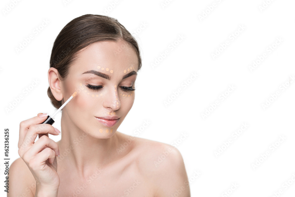 Beautiful young lady keeping make-up tassel Beautiful young lady keeping make-up tassel