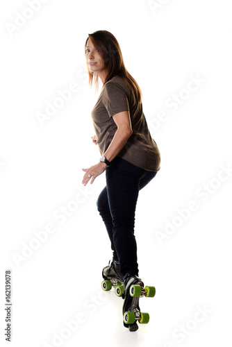 woman roller skating backwards and stopping photo