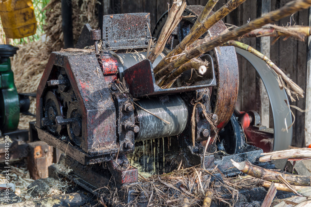 Small sugar cane mill producing panela (unrefined whole cane sugar), in Obando near San Agustin, Colombia Small sugar cane mill producing panela (unrefined whole cane sugar), in Obando near San Agustin, Colombia