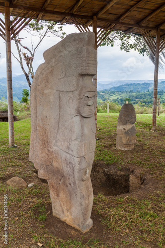 Ancient statues at Alto de Lavapatas site in archeological park in San Agustin, Colombia photo